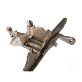 An Italian chiselled matchlock mechanism, 16th century