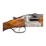 A cased double-barrelled over-and-under rifle by Hambrusch with three extra barrels