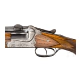 A cased double-barrelled over-and-under rifle by Hambrusch with three extra barrels