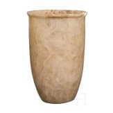 A tall, slender Egyptian alabaster cup, 2nd millennium B.C.
