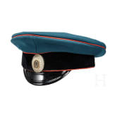 A Russian coat and cap of a first lieutenant in the artillery, circa 1915/16