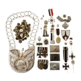 A militaria collection with orders, belt locks, ring collar