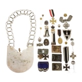 A militaria collection with orders, belt locks, ring collar