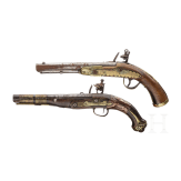Two Moroccan flintlock pistols and a powder flask, 19th./20th century
