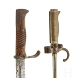 A German sidearm M 98/05 with saw back, and a French bayonet