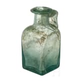 A Roman glass bottle, 2nd - 4th century