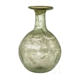 A bellied Roman glass bottle, 1st - 3rd century
