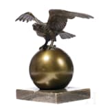 A small table eagle on a globe