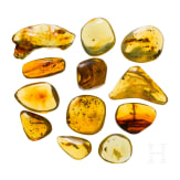 12 amber stones with inclusions