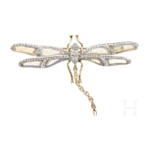 A gold and diamond dragonfly-shaped brooch