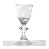 A glass goblet with crowned mirror monogram, circa 1710