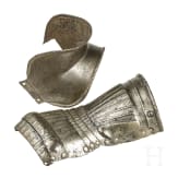 A German Maximilian gauntlet and fragment of a couter, beginning of the 16th century