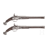 A pair of deluxe chiselled flintlock pistols, Cunet, Lyon, circa 1660