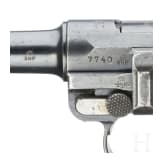 A Luger pistol by DWM, 1915, with holster