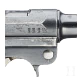 A Luger pistol by DWM, 1915, with holster