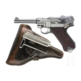 A Luger pistol by Mauser, code "K - S/42", with two matching-number mags and holster