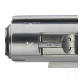 A Luger pistol by Mauser, code "K - S/42", with two matching-number mags and holster