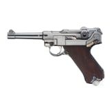 A Luger pistol by Mauser, code "K - S/42", with two matching-number mags and holster