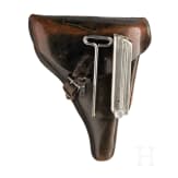 A Luger pistol by Mauser, code "K - S/42", with two matching-number mags and holster