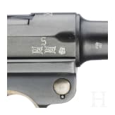 A Luger pistol by Mauser, code "K - S/42", with two matching-number mags and holster