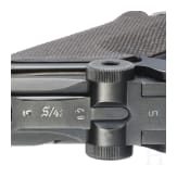 A Luger pistol by Mauser, code "K - S/42", with two matching-number mags and holster