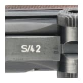 A Luger pistole by Mauser, code "1938 - S/42", 2 matching magazines, holster; Kriegsmarine