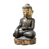 A gilt and black-lacquered Burmese wood figure of Buddha Shakyamuni, 19th century