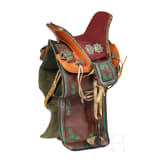 A richly decorated Sino-Tibetan saddle, 20th century