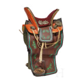 A richly decorated Sino-Tibetan saddle, 20th century