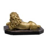 A South German reclining bronze lion with orb, probably circa 1900