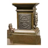 A large German bronze obelisk with silver-appliqués