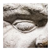 An Italian limestone capital in the shape of a head, 14th/15th century