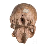 An Italian terracotta memento mori skull, 17th/18th century