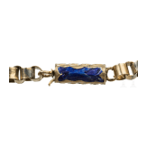 An enamelled gold and almandine necklace