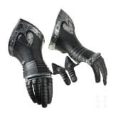 A pair of German black and white gauntlets, circa 1580