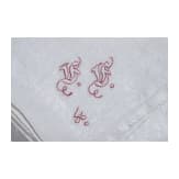 Seven monogrammed cloth napkins, circa 1900