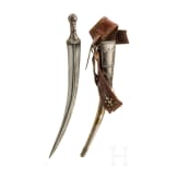 A Saudi Arabian silver-mounted Wahabite djambya with a sling, c. 1900