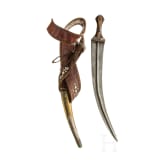 A Saudi Arabian silver-mounted Wahabite djambya with a sling, c. 1900