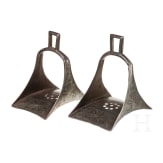A pair of Persian silver damascened stirrups, 19th century