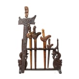 Five Indonesian kerises and a stand, 20th century