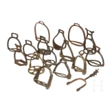 15 German iron and brass stirrups and one iron spore, 16th - 18th century