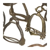15 German iron and brass stirrups and one iron spore, 16th - 18th century