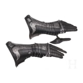 A pair of German black and white gauntlets, circa 1580