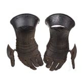 A pair of German black and white gauntlets, circa 1580
