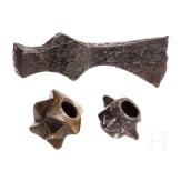 Two Eastern European mace heads and an axe, 12th/13th century