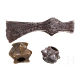 Two Eastern European mace heads and an axe, 12th/13th century