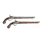 A magnificent pair of German chiselled flintlock pistols, circa 1780