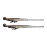 A magnificent pair of German chiselled flintlock pistols, circa 1780