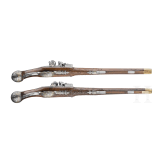 A magnificent pair of German chiselled flintlock pistols, circa 1780