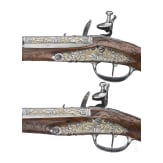A magnificent pair of German chiselled flintlock pistols, circa 1780